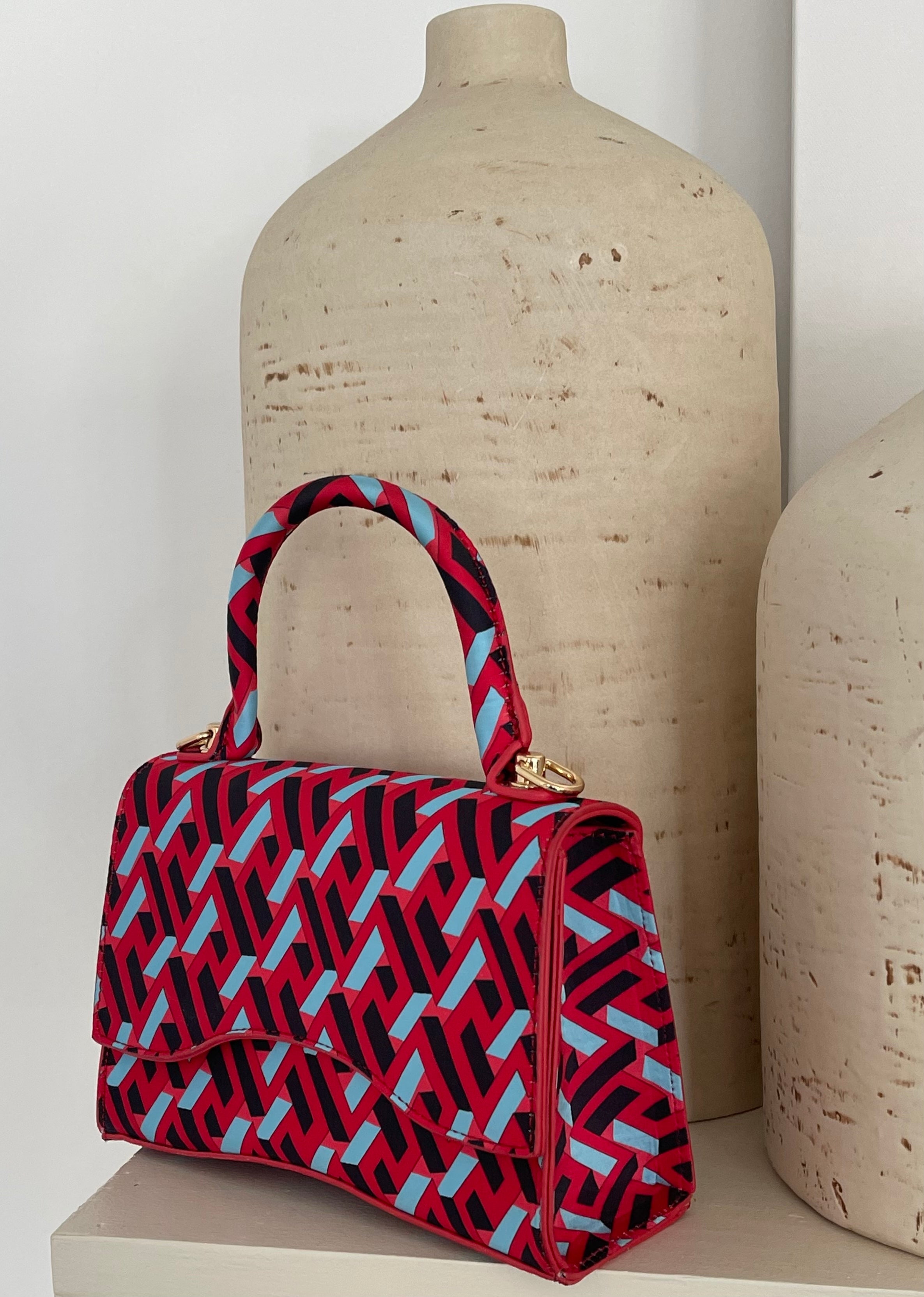 Red bag with multicolored accents at Kiki's Stocksale